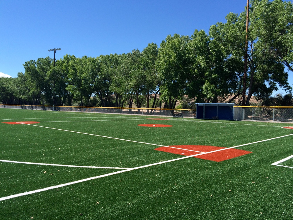 synthetic turf field and dugouts